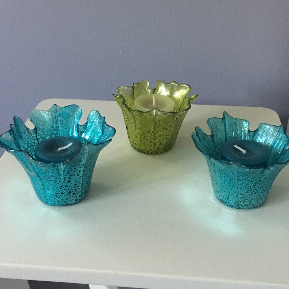 Set of three candle holders with scented candles